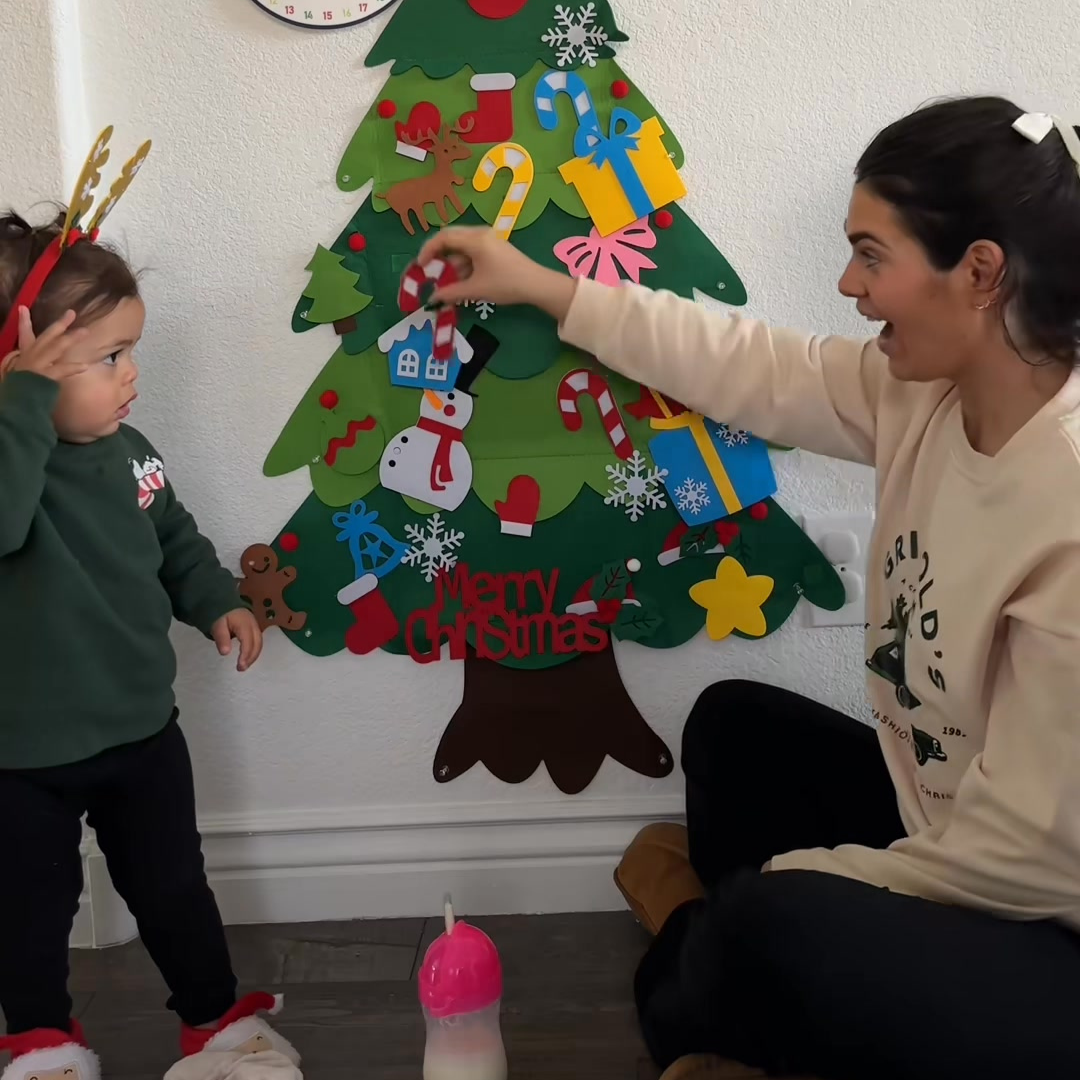 The TibaToes felt Christmas tree hung on a playroom wall